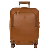 Tan Bric's Cabin Spinner Suitcase with four wheels and sleek design, perfect for travel and easy maneuverability.