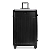 Briggs & Riley Sympatico 3.0 black extra large spinner suitcase with four wheels and a spacious interior.