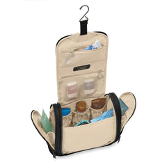 Briggs & Riley Deluxe Hangable Kit in black, showcasing a spacious washbag with multiple compartments and hanging hooks.