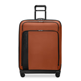 Large expandable spinner suitcase by Briggs & Riley in canyon color, featuring durable wheels and spacious interior for travel.