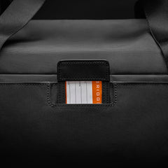 Large black travel duffle bag by Briggs & Riley, featuring durable fabric and spacious interior for travel essentials.