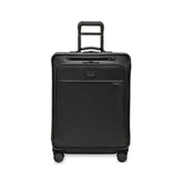 Briggs & Riley Baseline 2 medium expandable spinner suitcase in black, showcasing its sleek design and durable wheels.