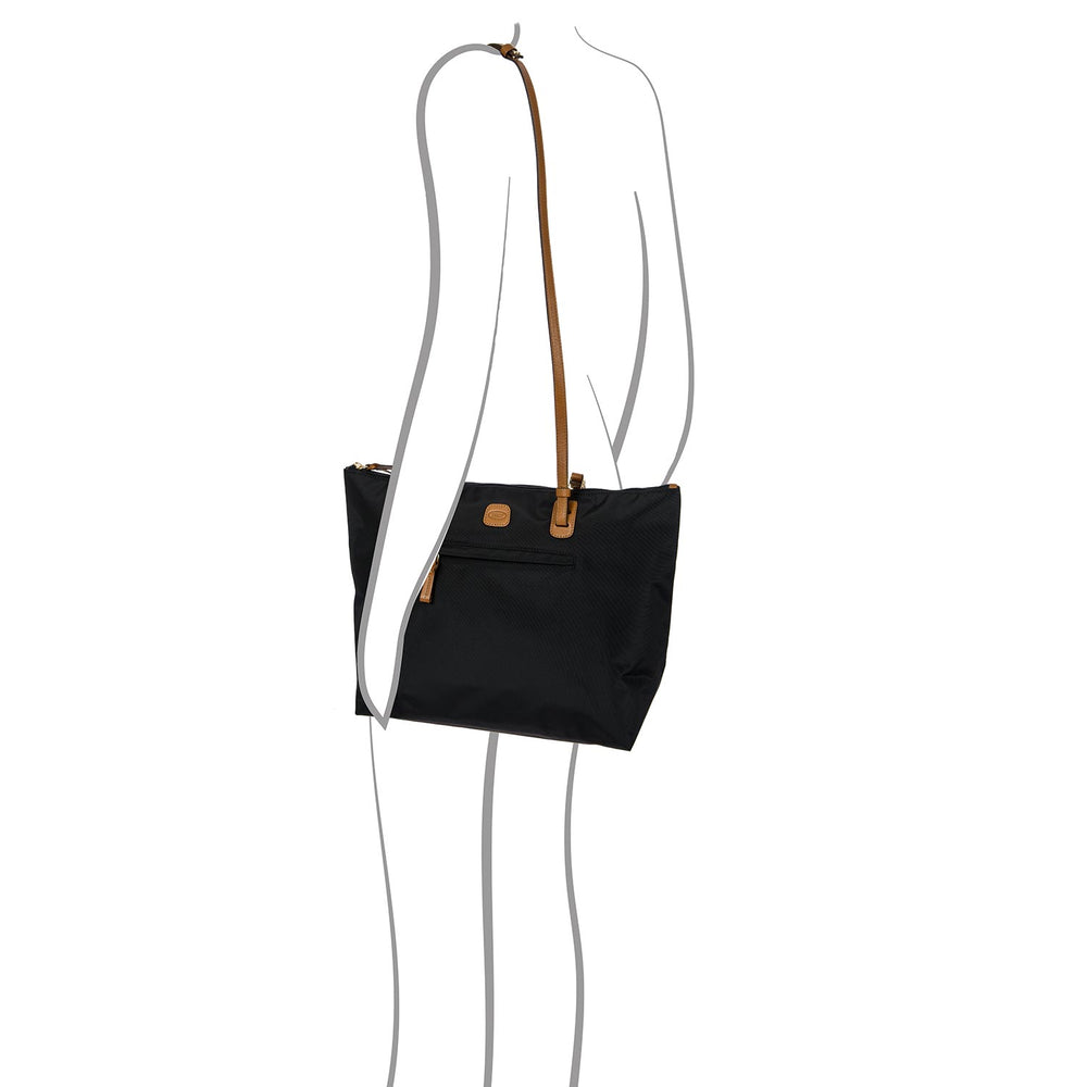 Large black Sportina Bag by Bric's, a stylish duffle perfect for travel or gym use, showcasing sleek design and sturdy handles.