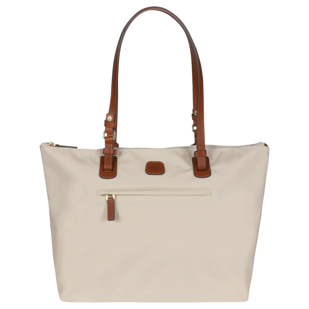Beige Bric's Large Sportina Bag, a stylish duffle perfect for travel and everyday use, showcasing spacious design and durable material.