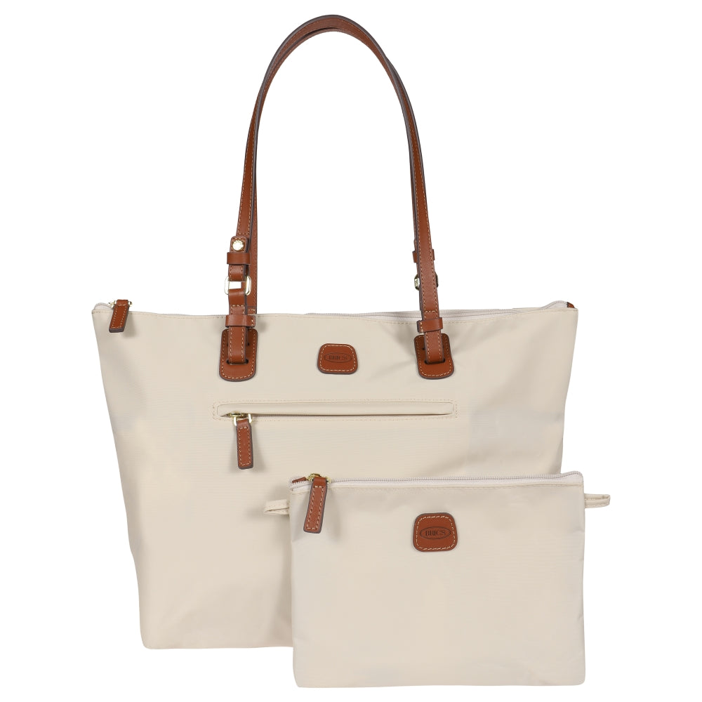 Beige Large Sportina Bag by Bric's, spacious duffle with sleek design and sturdy handles, ideal for travel and everyday use.