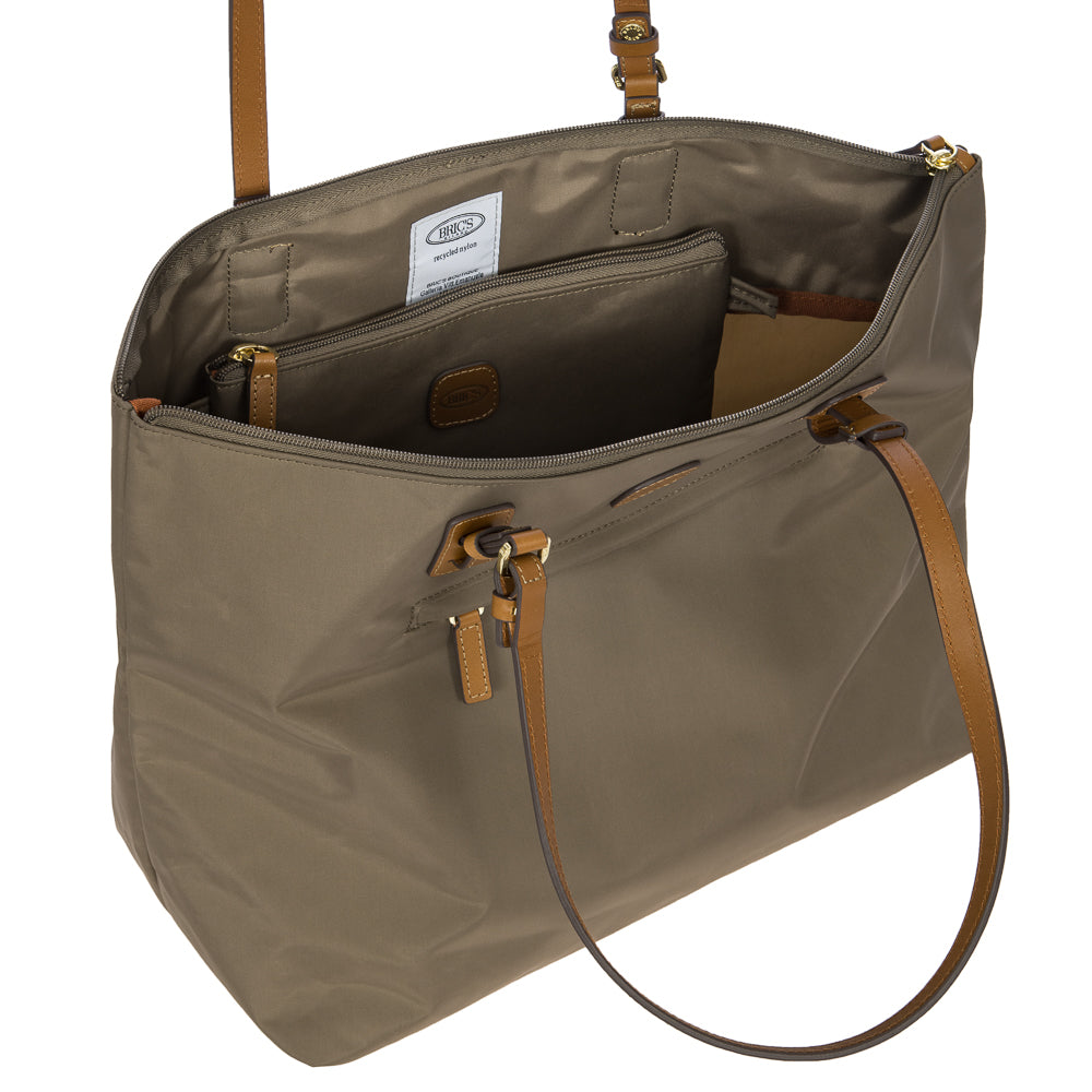 Large Sportina Bag by Bric's in nut color, showcasing a stylish duffle design with sturdy handles and spacious interior.