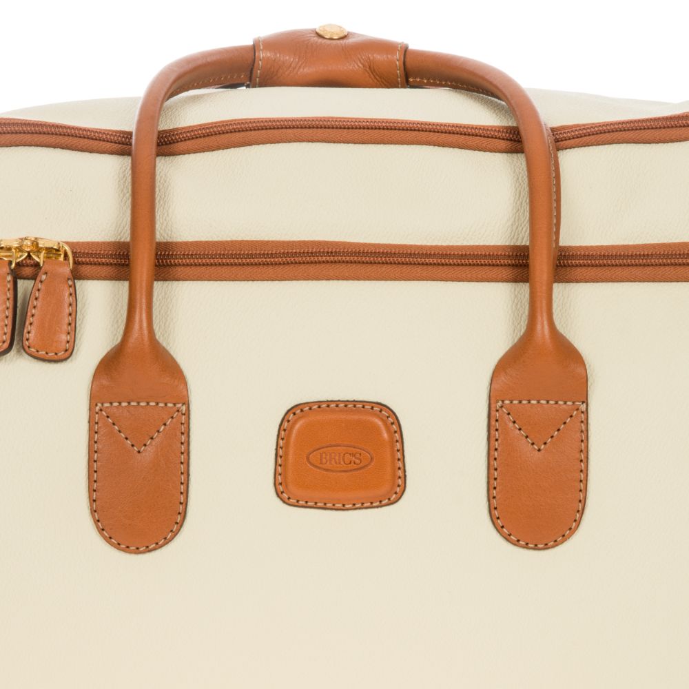 Cream small wheeled holdall by Bric's, lightweight duffle bag with wheels and handles, ideal for travel and storage.