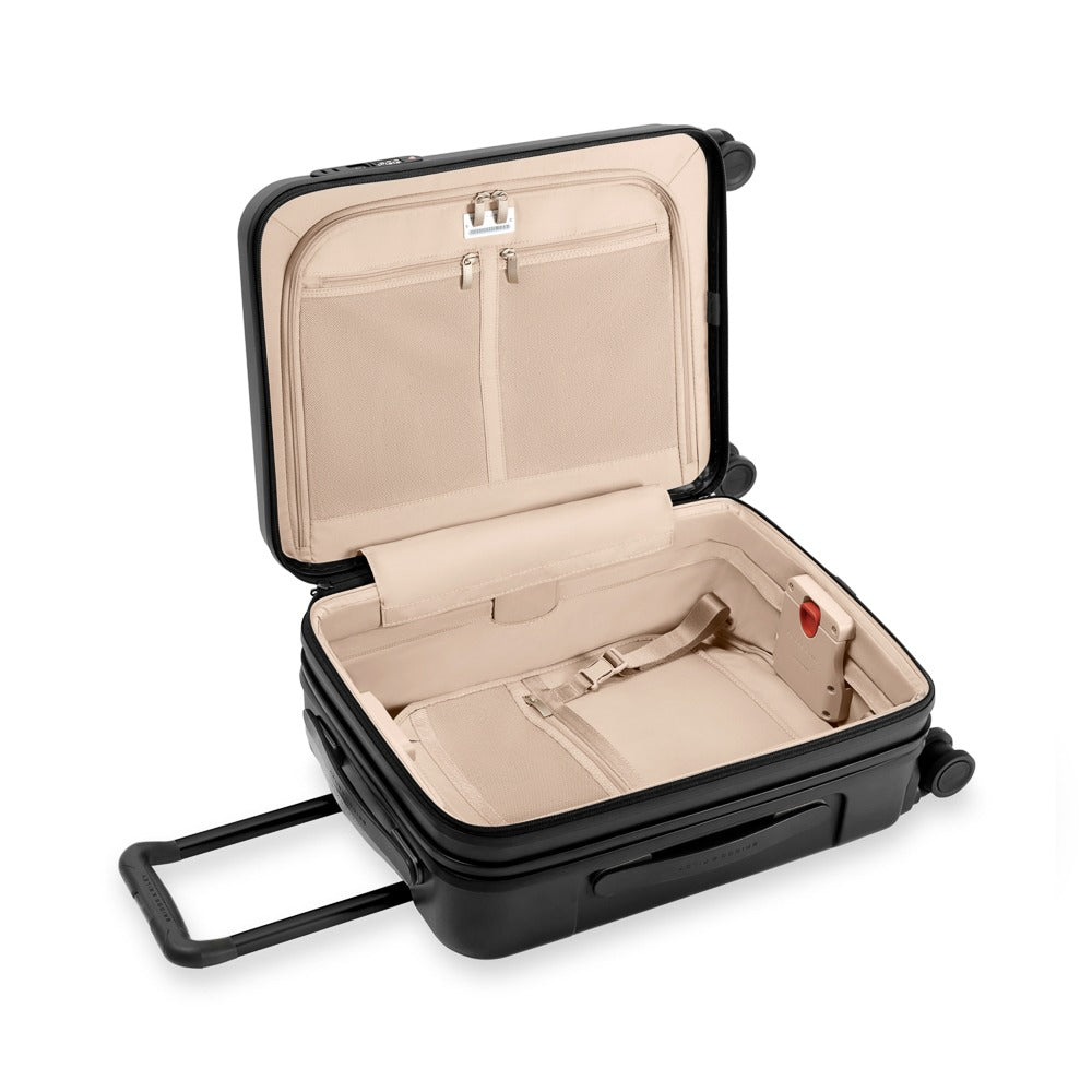 Briggs & Riley Sympatico 3.0 53cm expandable carry-on spinner suitcase in black, showcasing wheels and zipper details.