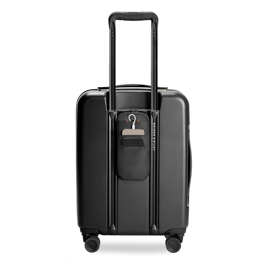 Briggs & Riley Sympatico 3.0 53cm expandable carry-on spinner suitcase in black, showcasing wheels and zipper details.