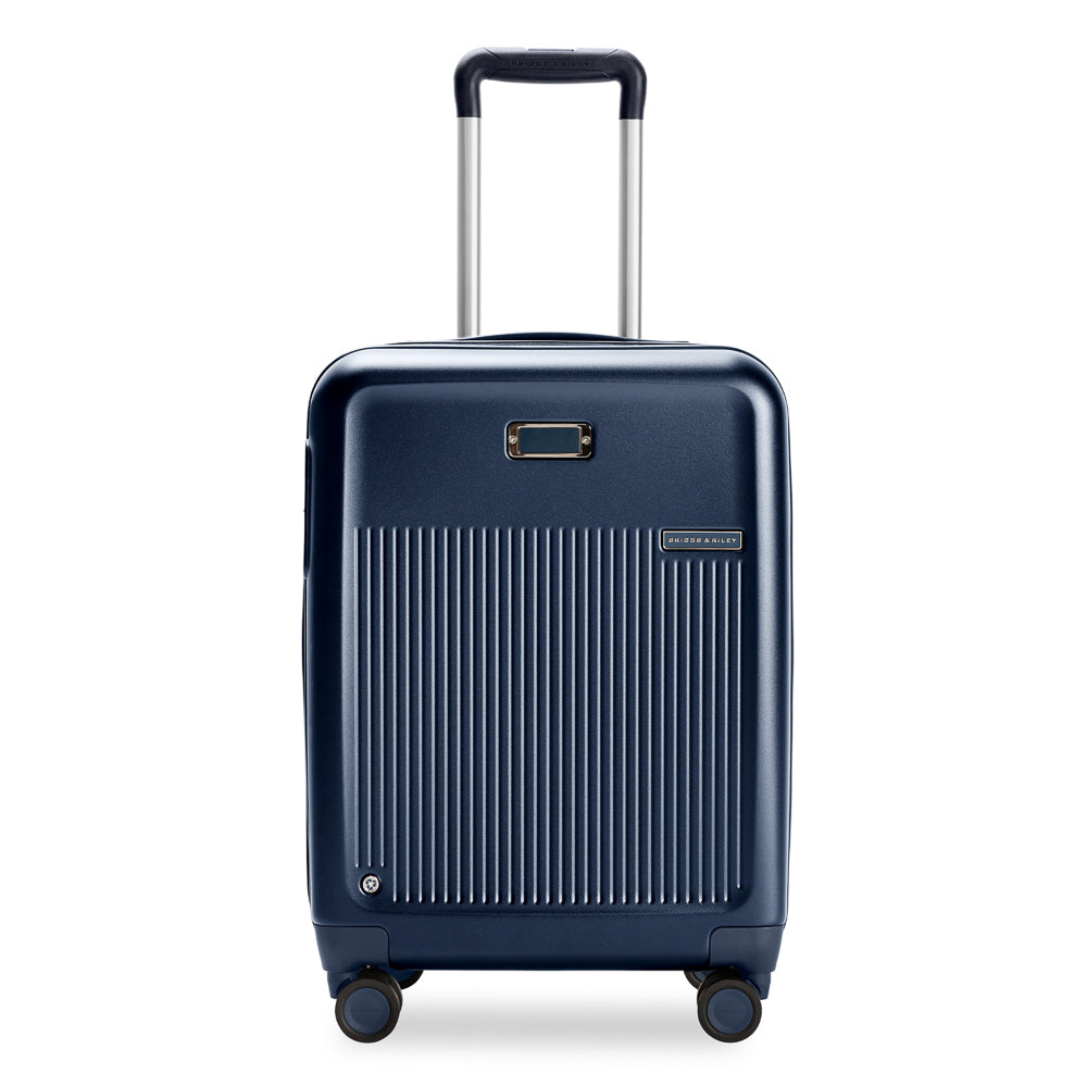 Navy Briggs & Riley Sympatico 3.0 53cm expandable carry on spinner suitcase with wheels and handle.