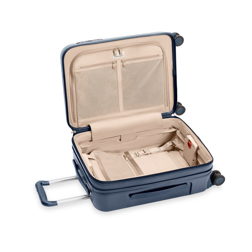 Briggs & Riley Sympatico 3.0 navy expandable carry-on spinner suitcase with smooth wheels and sturdy handle.