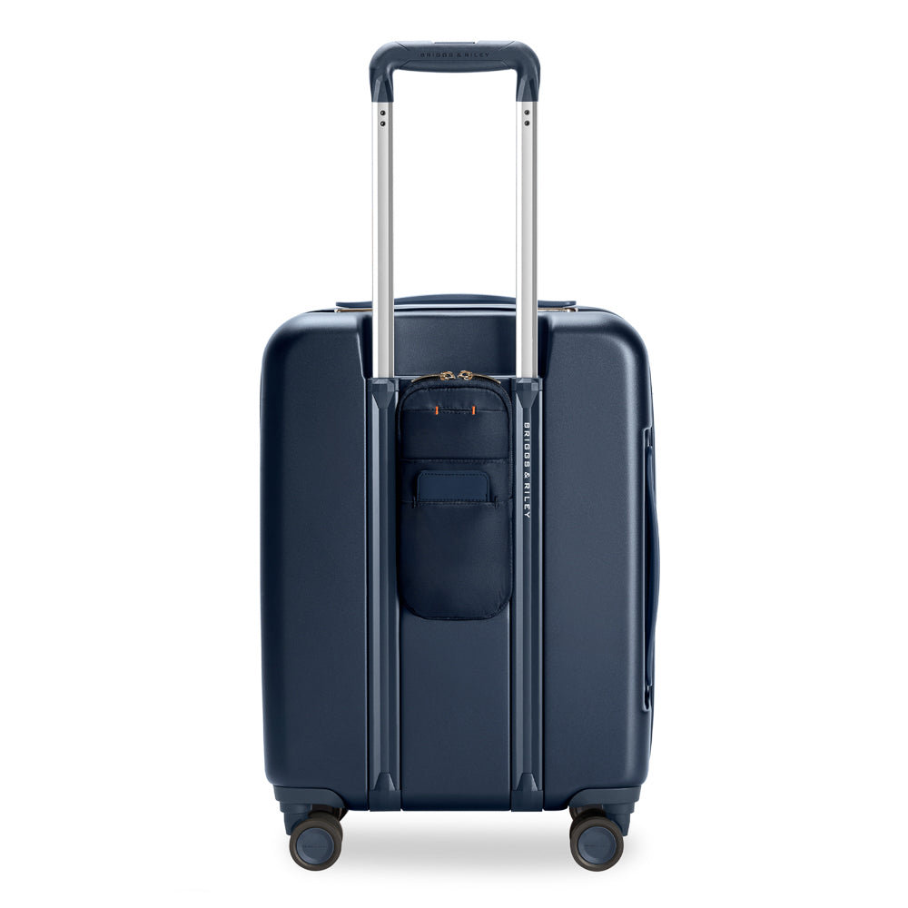 Briggs & Riley Sympatico 3.0 navy expandable carry-on spinner suitcase with wheels and handle.