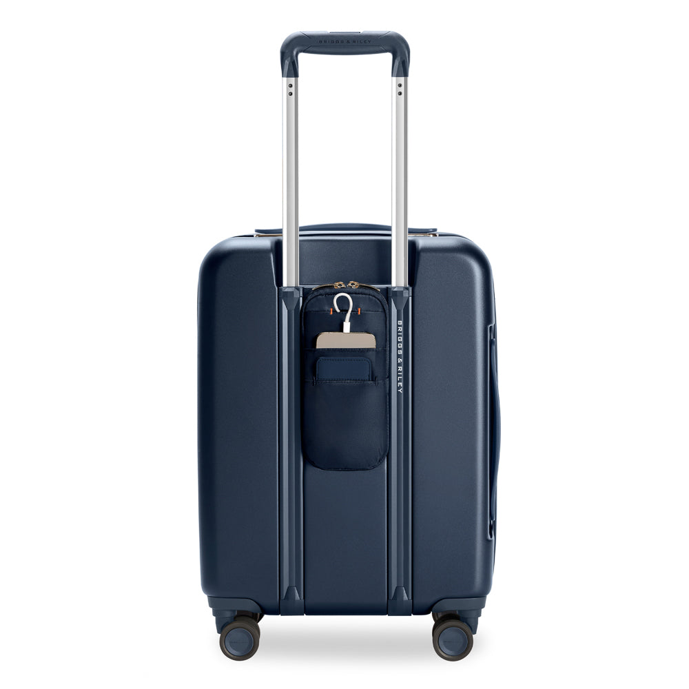Briggs & Riley Sympatico 3.0 navy expandable carry-on spinner suitcase with smooth wheels and sturdy handle.