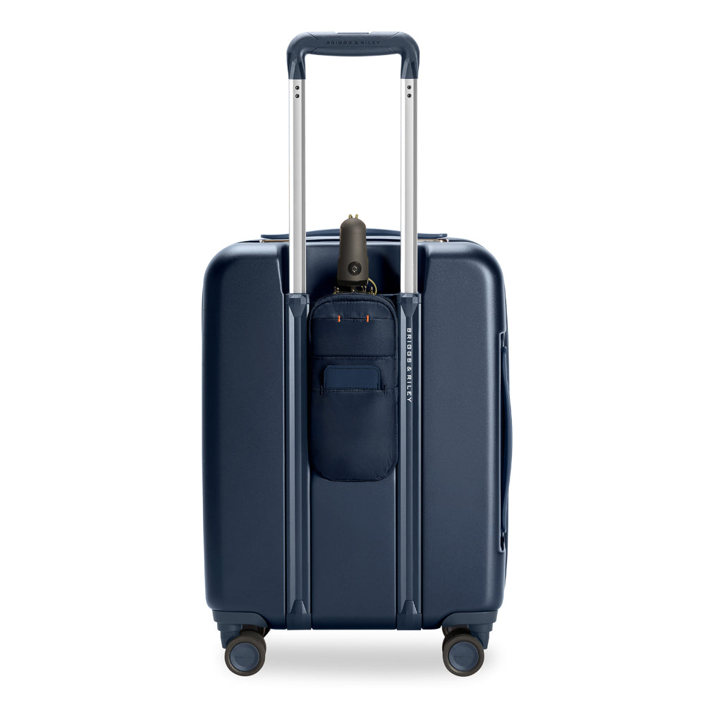 Briggs & Riley Sympatico 3.0 navy expandable carry-on spinner suitcase with smooth wheels and sturdy handle.