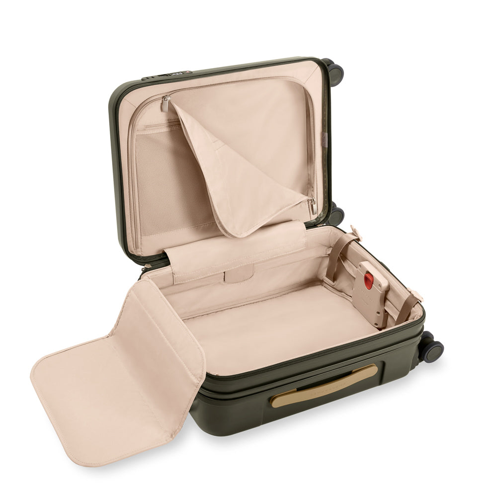 Olive 53cm expandable carry-on spinner suitcase by Briggs & Riley, featuring smooth wheels and durable construction.
