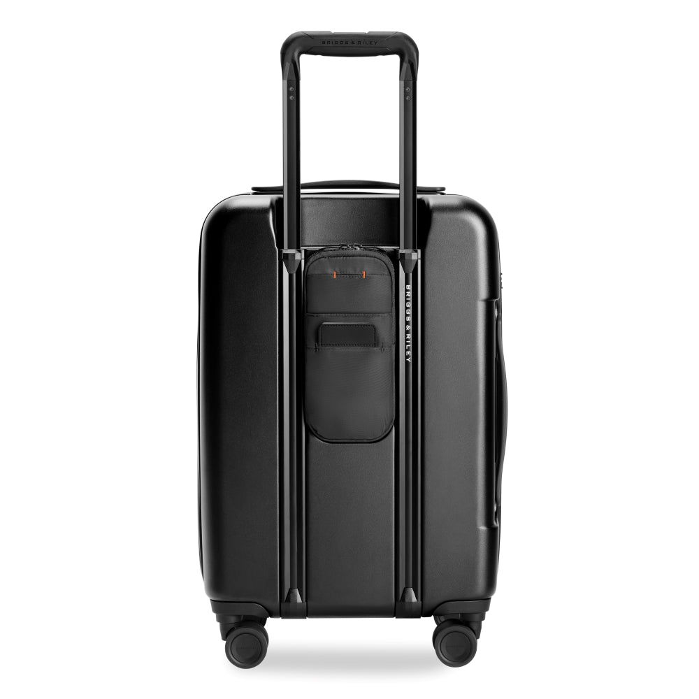 Briggs & Riley Sympatico 3.0 56cm black front pocket carry-on spinner suitcase on a white background.