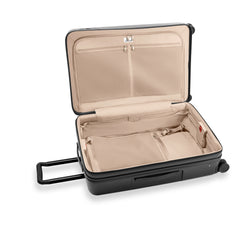 Briggs & Riley Sympatico 3.0 large expandable spinner suitcase in black, featuring wheels and sturdy handles for travel.