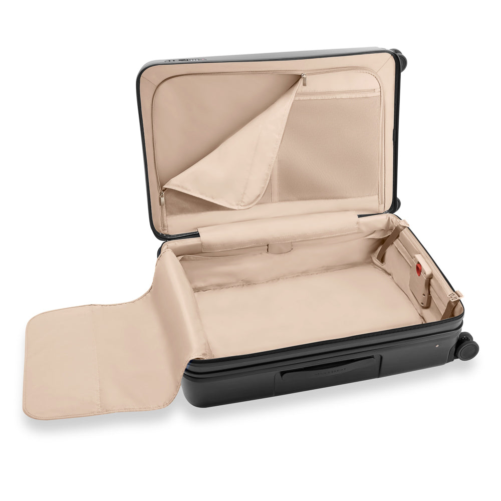Briggs & Riley Sympatico 3.0 large expandable spinner suitcase in black, showcasing spacious design and durable wheels.