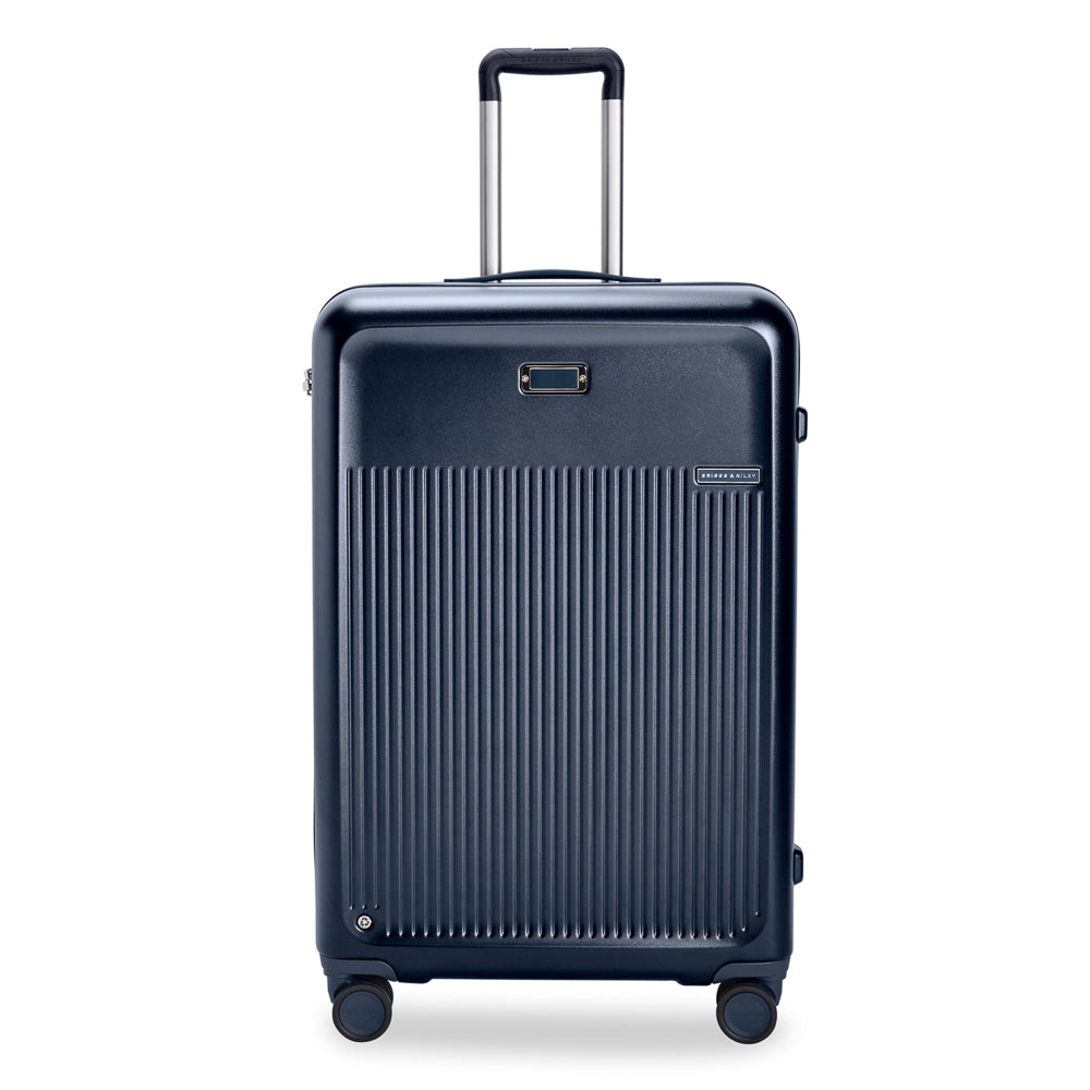 Navy 76cm Briggs & Riley Sympatico 3.0 expandable spinner suitcase with four wheels for easy travel.