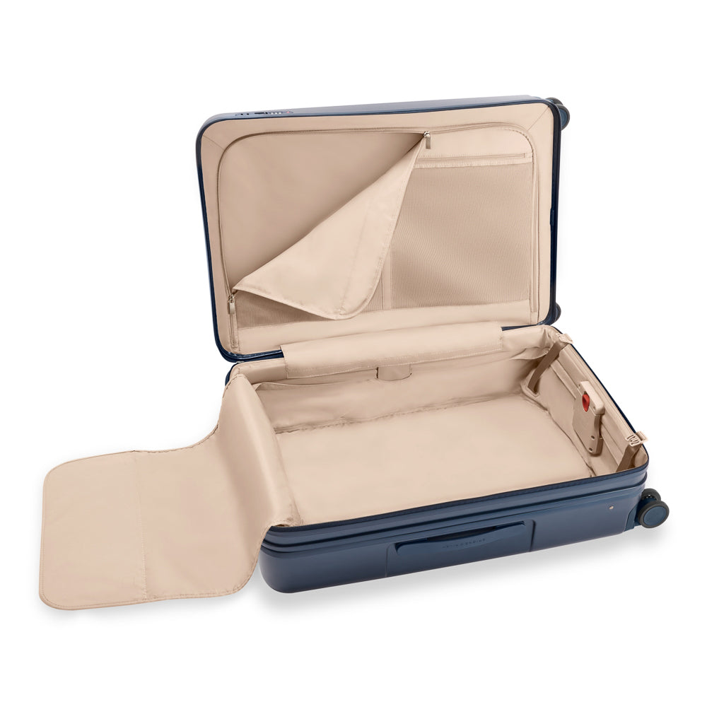 Large 76cm navy expandable spinner suitcase by Briggs & Riley, featuring a durable design and smooth-rolling wheels.