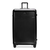 Briggs & Riley Sympatico 3.0 black extra large spinner suitcase with four wheels and a spacious interior.