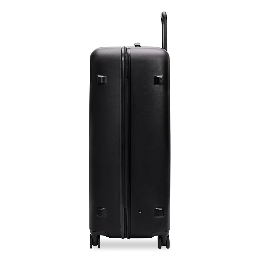 Briggs & Riley Sympatico 3.0 86cm black extra large spinner suitcase with 360-degree wheels and sturdy handle.
