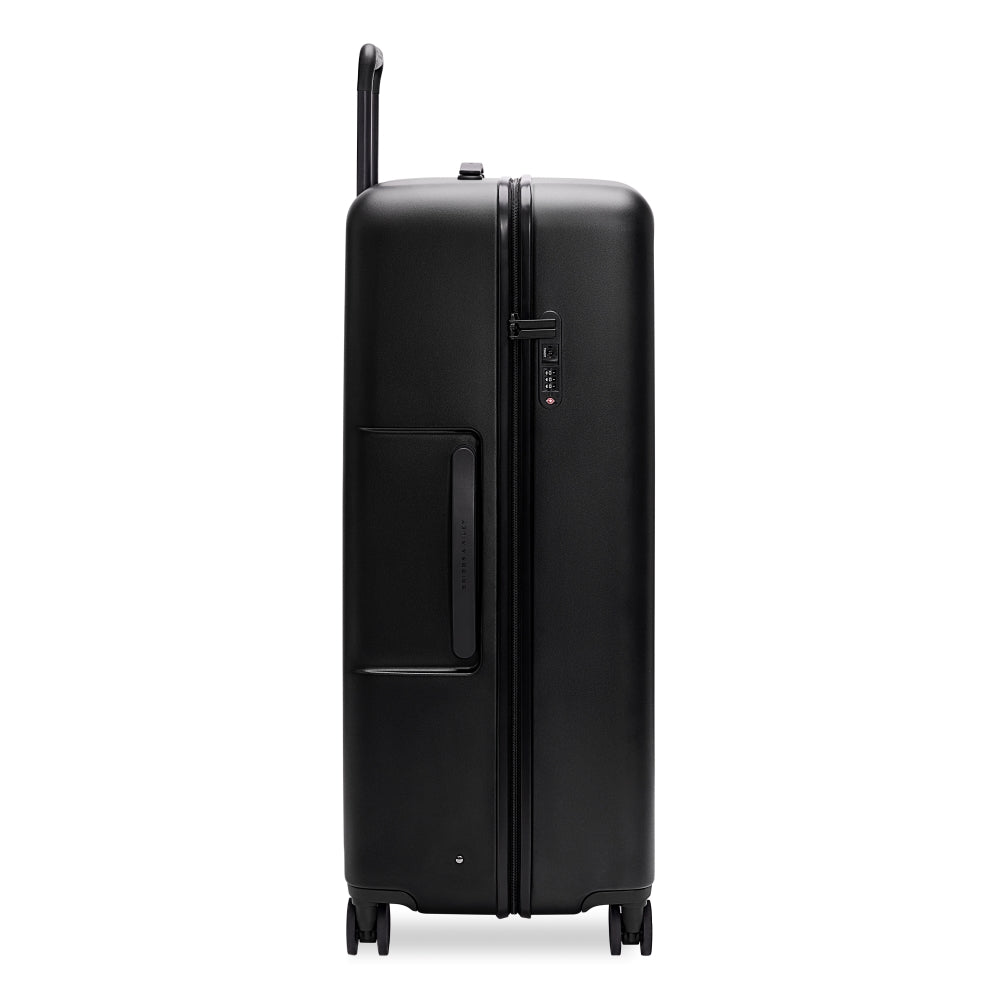 Briggs & Riley Sympatico 3.0 extra large black spinner suitcase with four wheels and expansive interior for check-in luggage.