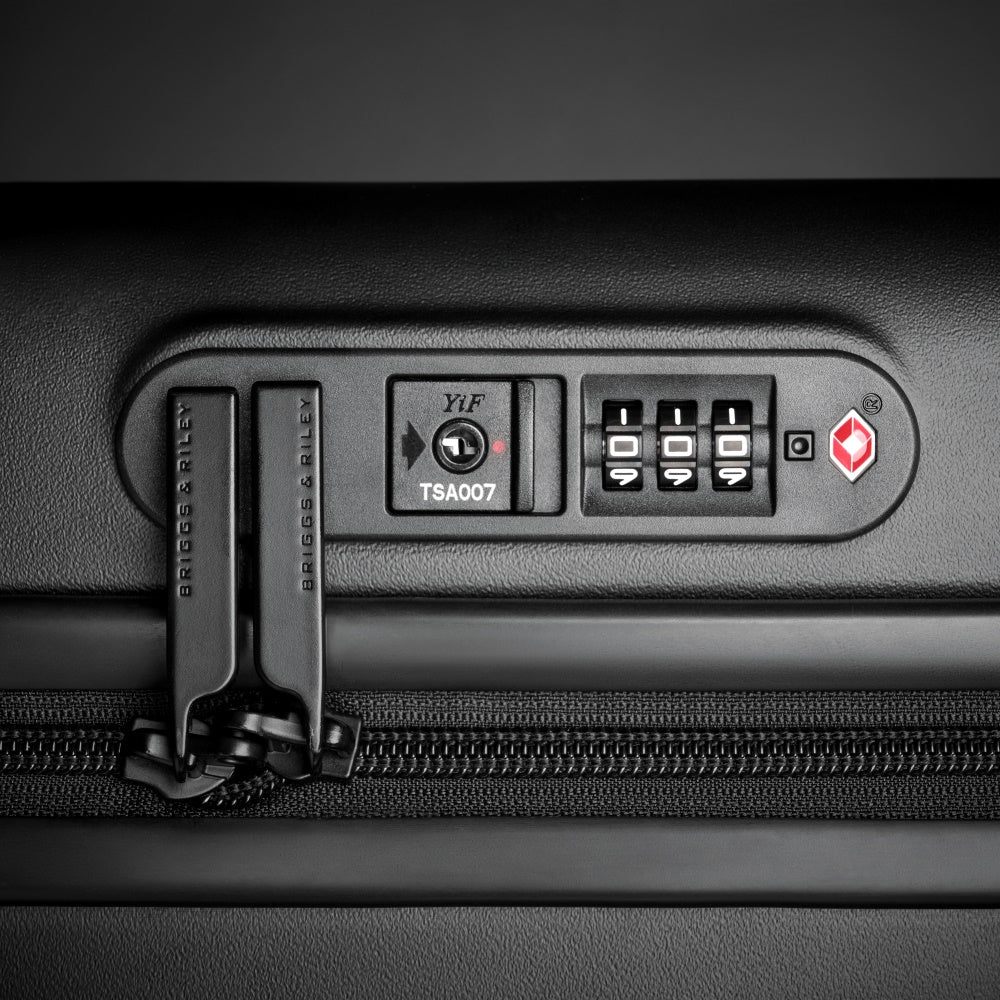 Briggs & Riley Sympatico 3.0 extra large black spinner suitcase, featuring smooth wheels and durable construction.