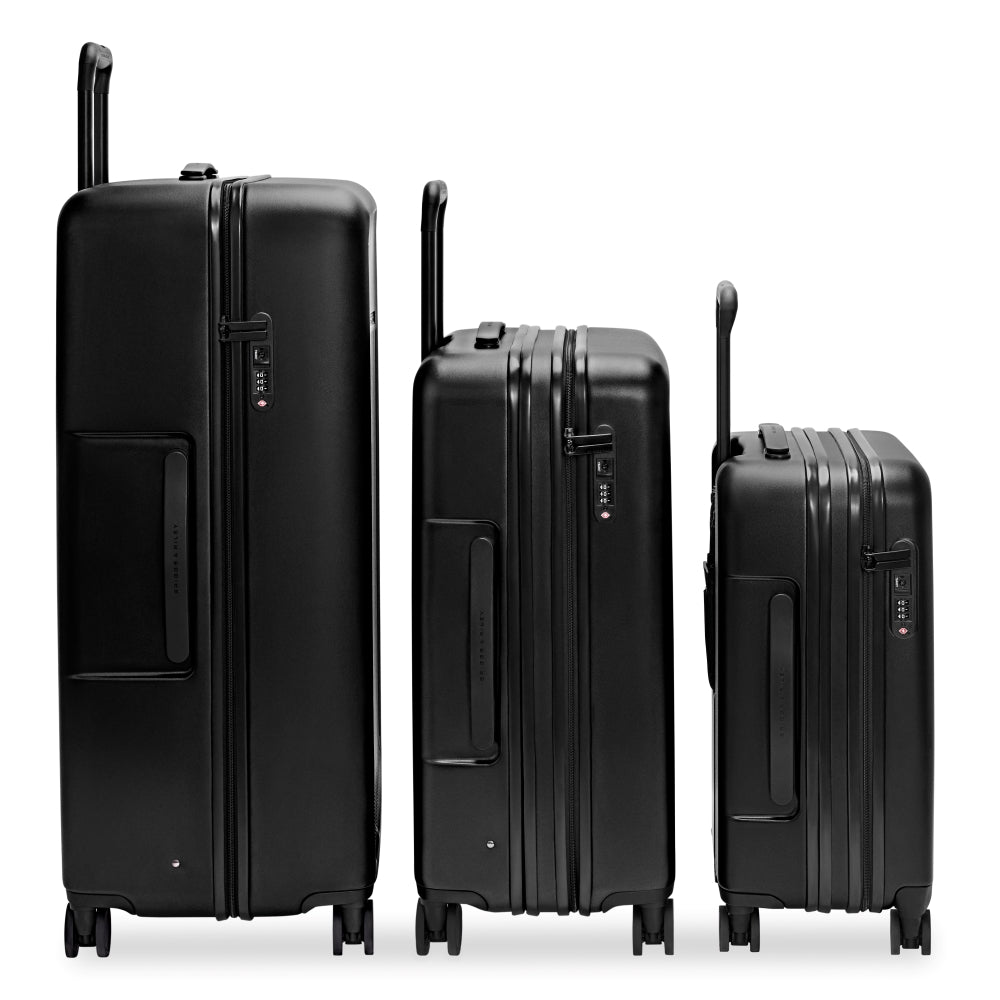 Briggs & Riley Sympatico 3.0 extra large black spinner suitcase with four wheels and a durable design.