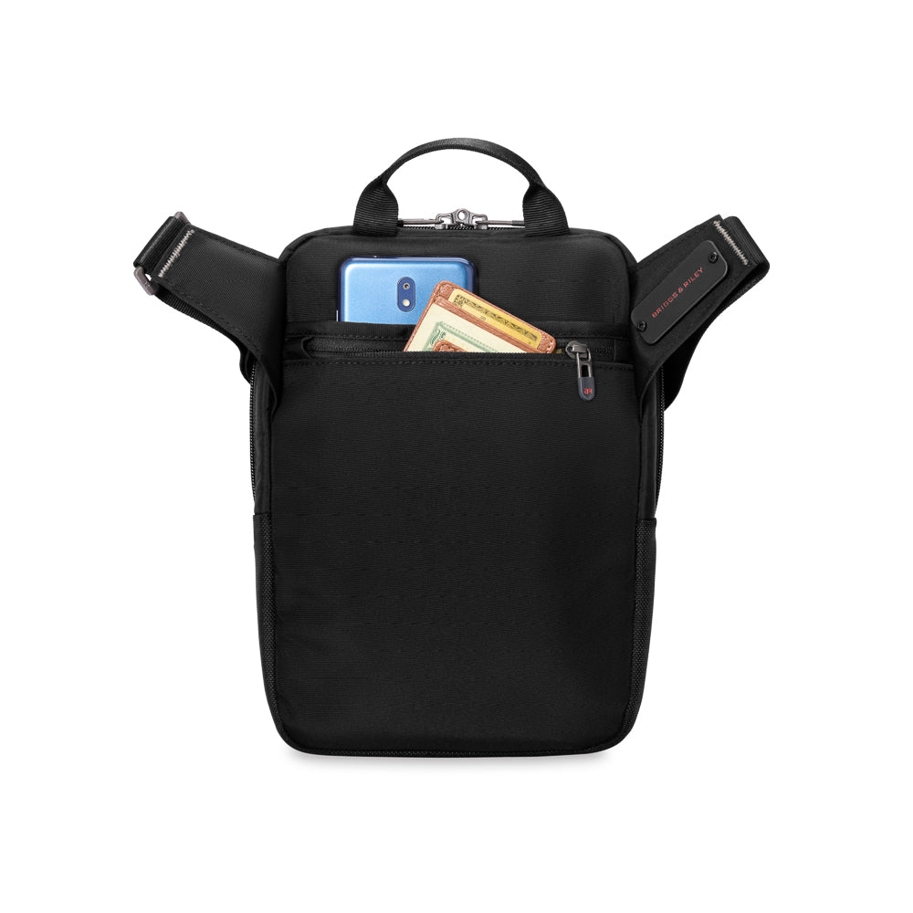 Black crossbody bag from the HTA Collection by Briggs & Riley, featuring a sleek design and spacious interior.