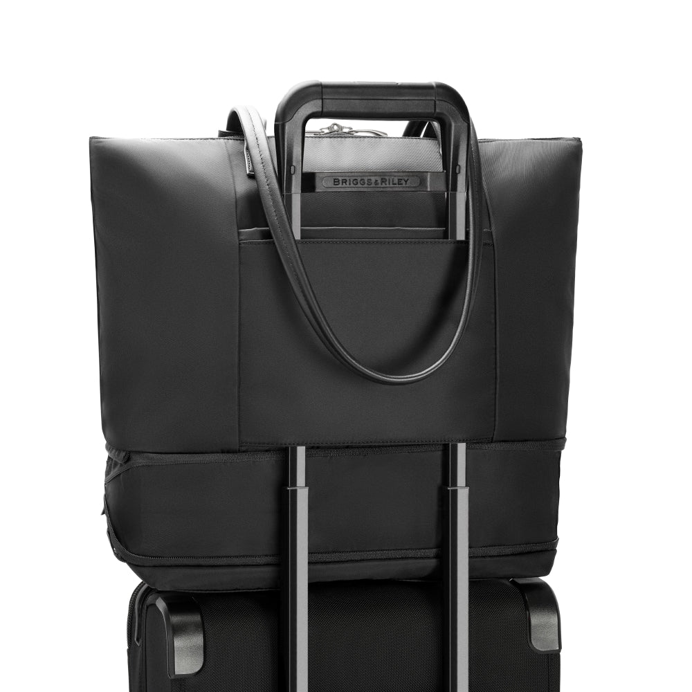 Briggs & Riley Rhapsody expandable travel tote bag in black, featuring spacious design and durable fabric for travel convenience.