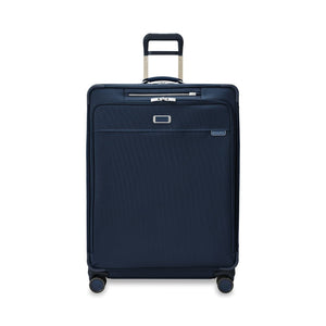 Briggs & Riley Baseline 2 extra large expandable spinner suitcase in navy, showcasing smooth wheels and spacious interior.