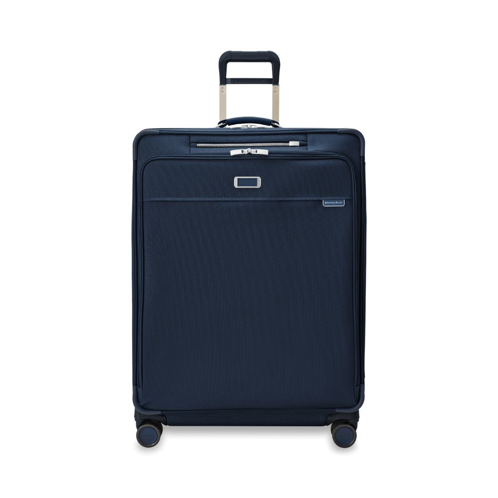 Briggs & Riley Baseline 2 extra large expandable spinner suitcase in navy, showcasing smooth wheels and spacious interior.