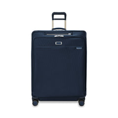 Briggs & Riley Baseline 2 extra large expandable spinner suitcase in navy, showcasing smooth wheels and spacious interior.