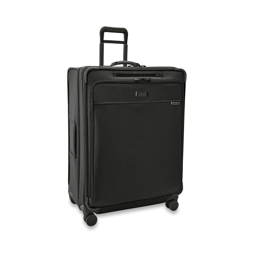 Extra large black expandable spinner suitcase by Briggs & Riley, showcasing durable design and spacious interior for travel.