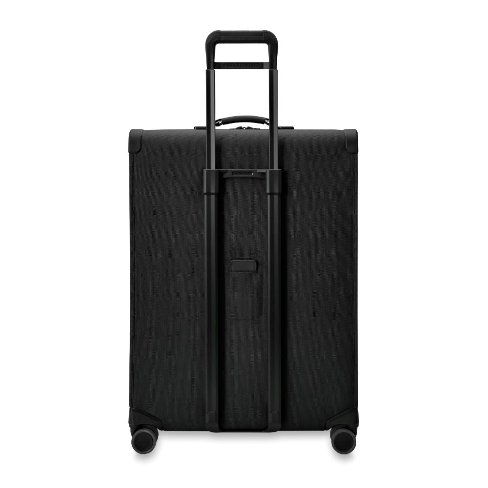 Briggs & Riley Baseline 2 extra large expandable spinner suitcase in black, showcasing its smooth wheels and spacious interior.