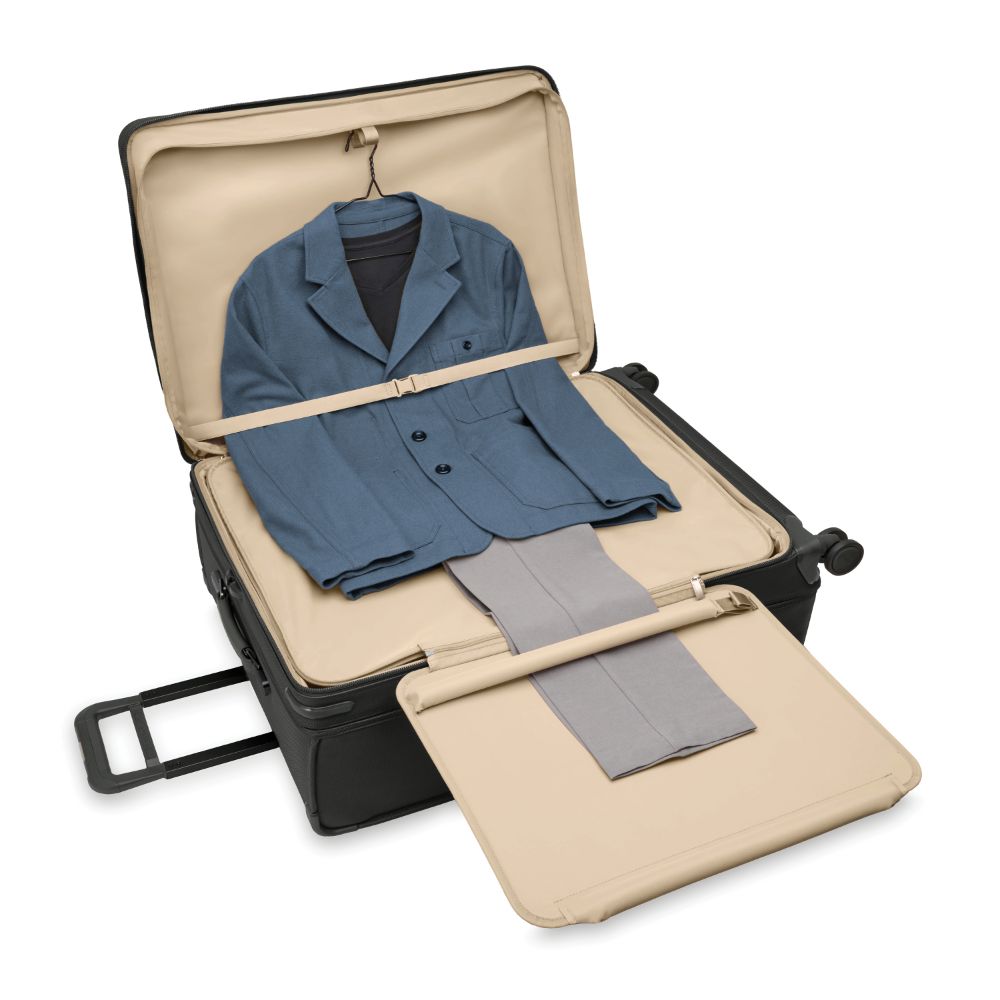 Extra large expandable spinner suitcase in black from Briggs & Riley, featuring durable wheels and spacious compartments.