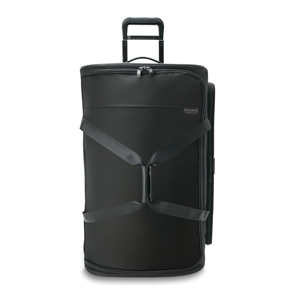 Large black Briggs & Riley Baseline 2 wheel duffle bag with sturdy handles and spacious interior for travel.