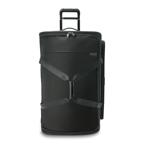 Large black Briggs & Riley Baseline 2 wheel duffle bag with sturdy handles and spacious interior for travel.