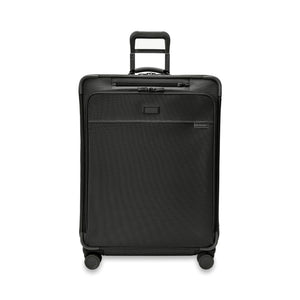 Large Briggs & Riley Baseline 2 expandable spinner suitcase in black, showcasing spacious compartments and smooth wheels.