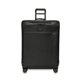 Large Briggs & Riley Baseline 2 expandable spinner suitcase in black, showcasing spacious compartments and smooth wheels.