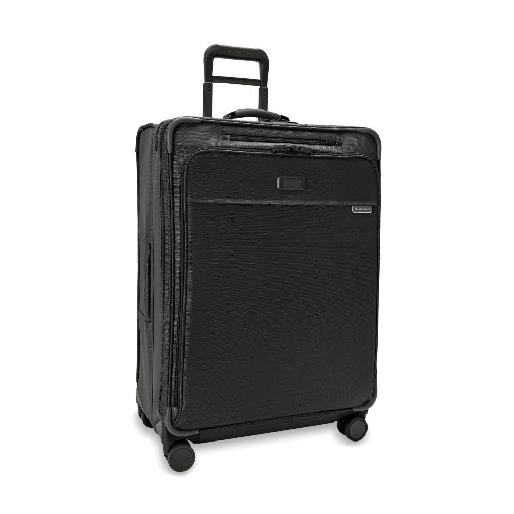 Briggs & Riley Baseline 2 large expandable spinner suitcase in black with 360-degree wheels and sturdy handle.