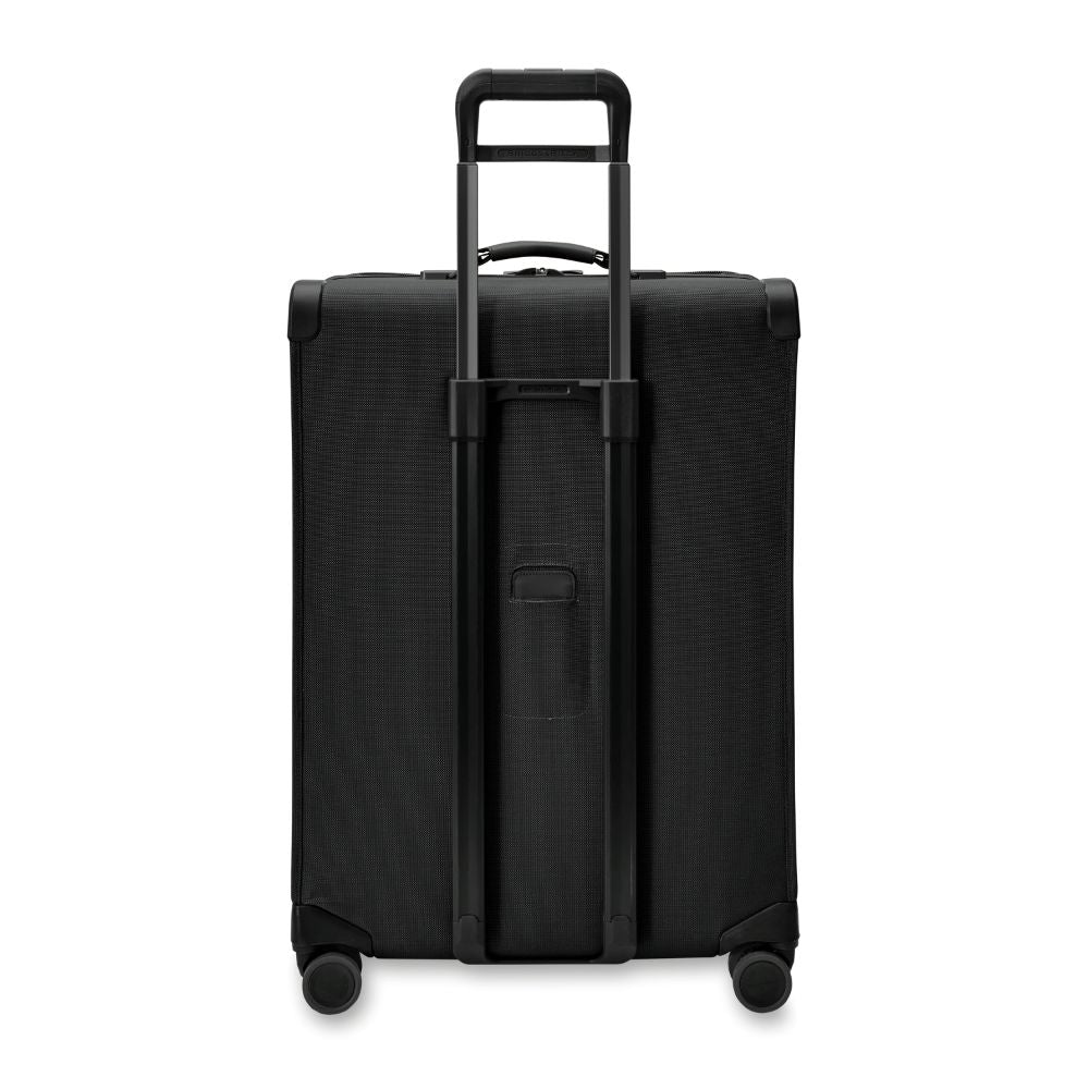 Briggs & Riley Baseline 2 large expandable spinner suitcase in black, featuring smooth wheels and a spacious interior.
