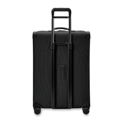 Briggs & Riley Baseline 2 large expandable spinner suitcase in black, featuring smooth wheels and a spacious interior.