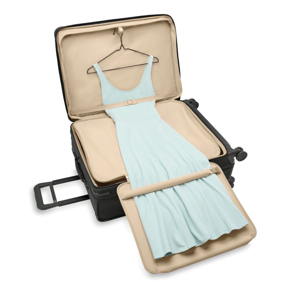 Black Briggs & Riley Baseline 2 large expandable spinner suitcase with smooth wheels and sturdy handle.