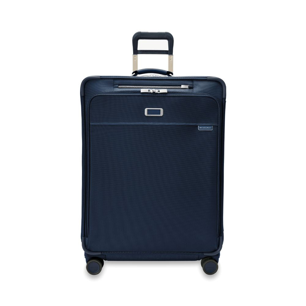 Briggs & Riley Baseline 2 large expandable spinner suitcase in navy, featuring a sleek design and durable wheels.