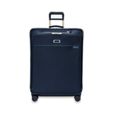 Briggs & Riley Baseline 2 large expandable spinner suitcase in navy, featuring a sleek design and durable wheels.