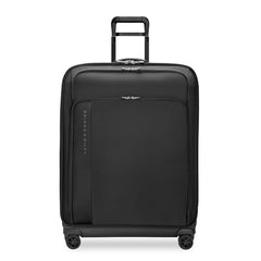 Large expandable spinner suitcase by Briggs & Riley in black, showcasing its durable exterior and spacious interior.
