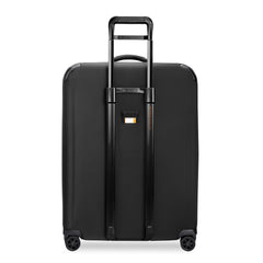 Large expandable spinner suitcase in black by Briggs & Riley, featuring smooth wheels and spacious interior for travel.