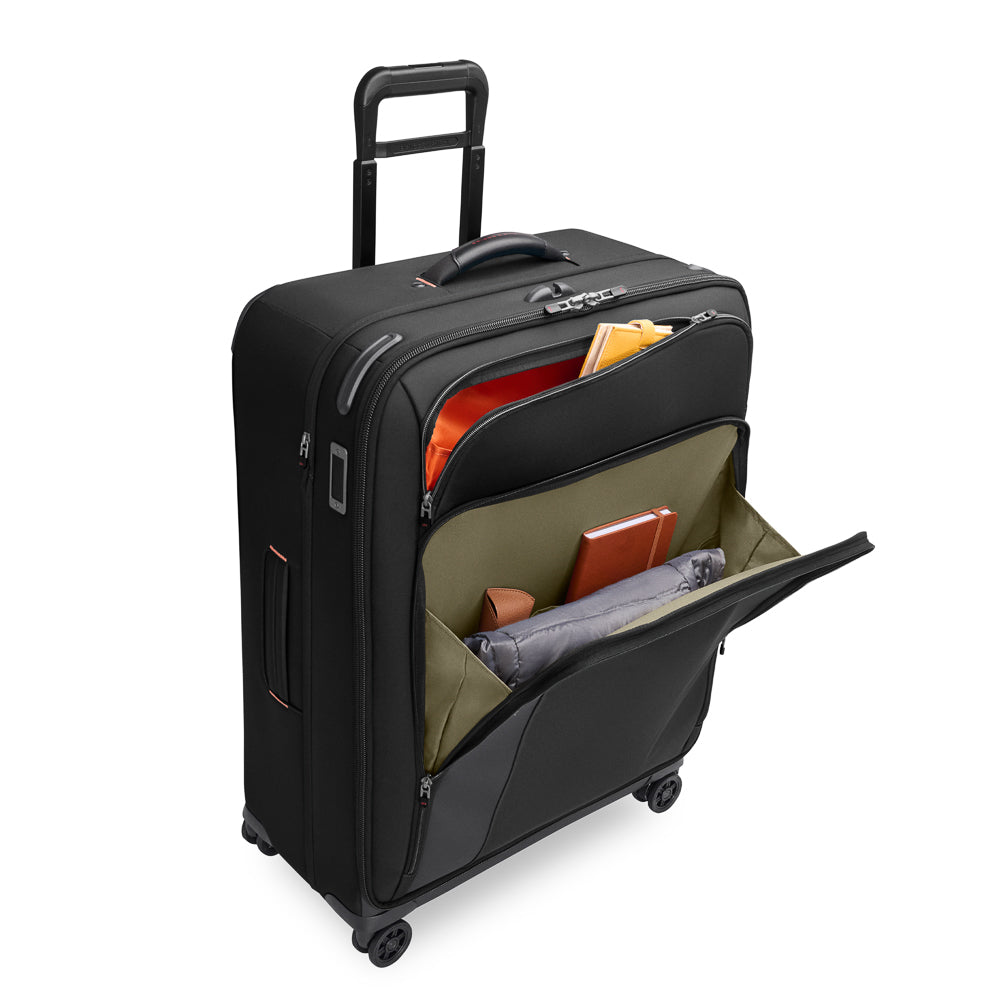 Large black expandable spinner suitcase by Briggs & Riley, featuring smooth wheels and spacious interior for travel.